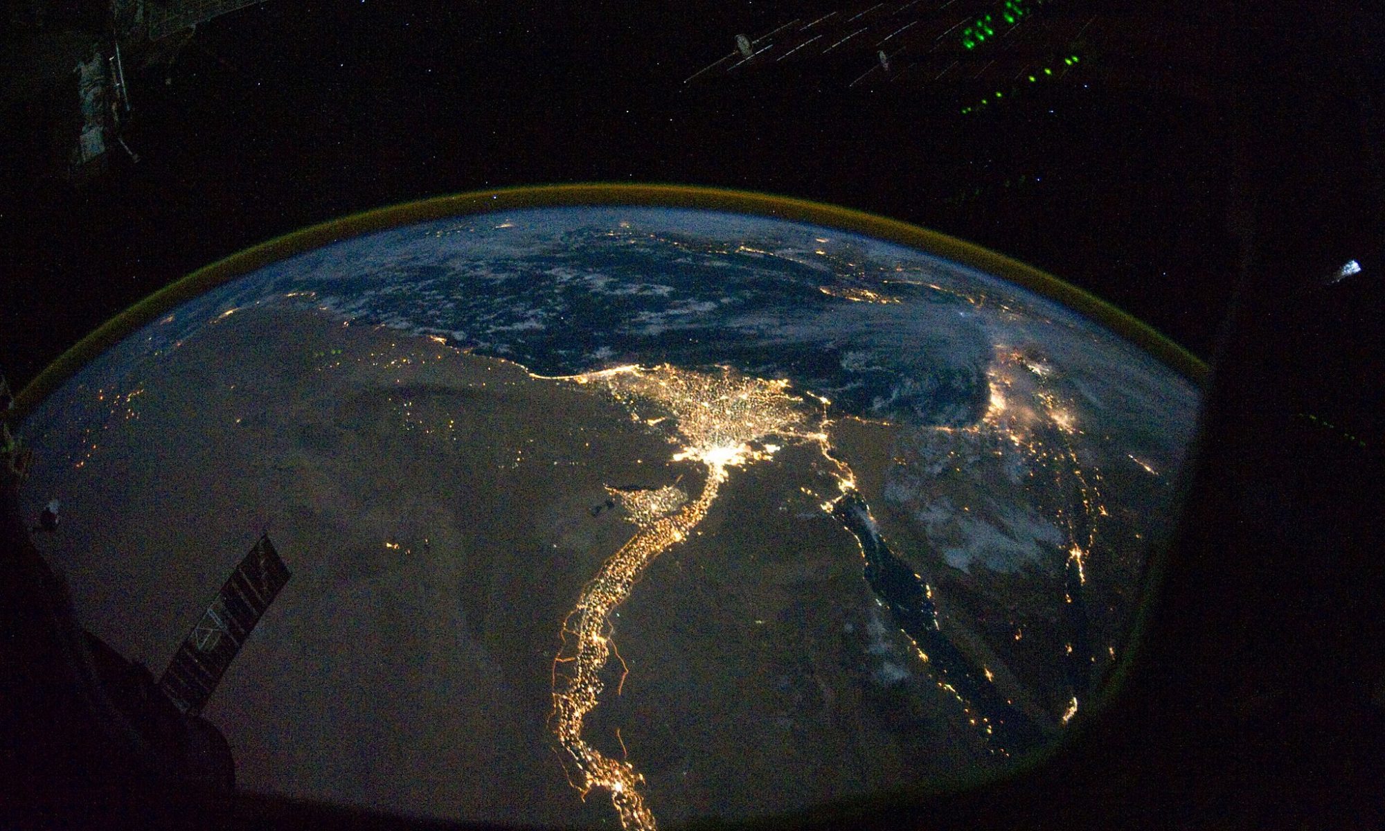 Satelite image of the Eart at night, showing the Nile illuminated by the electric light of cities and roads