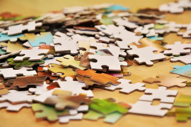 a pile of jigsaw puzzle pieces