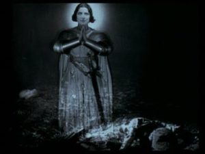 The shot of Joan’s floating apparition, sanctifying Trent’s sacrifice, represents the implied ambiguity of the action.