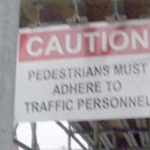 Sign: A new take on getting close: Pedestrians Must Adhere To Traffic Personnel