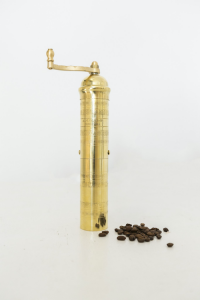 Brass hand-cranked coffee mill