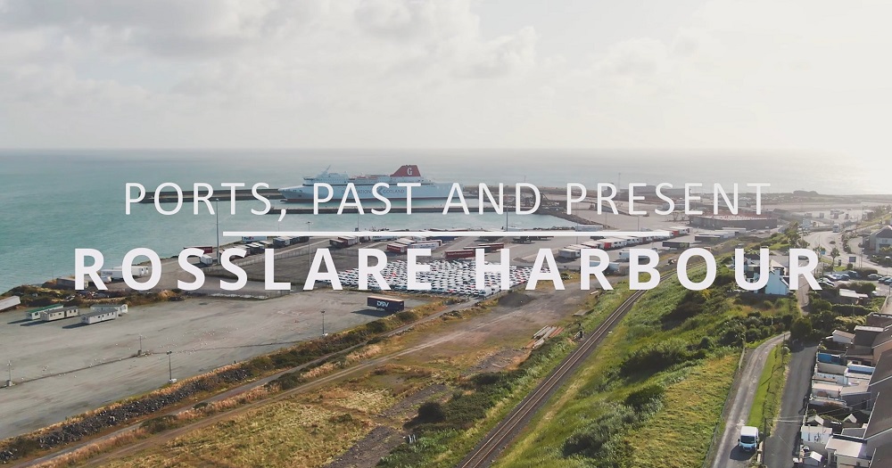 title screen for the film "Ports, Past and Present: Rosslare Harbour", showing the title superimposed over an aerial view of the ferry port with a vessel docked at the quay