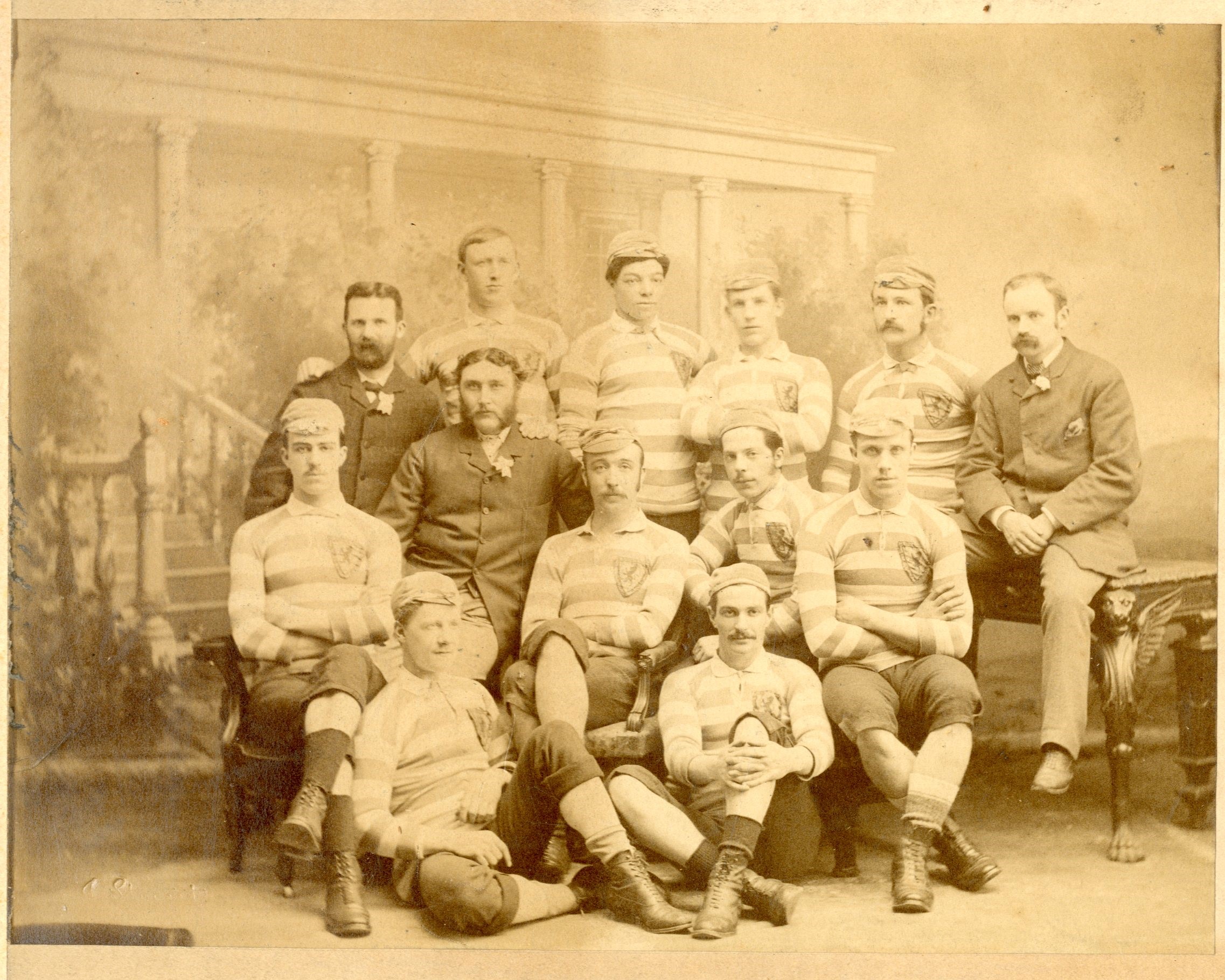 Team photo showing the Scotland team before their 5-1 victory against England at the first Hampden Park in 1882, courtesy Scottish Football Museum. This is the first time the team were given caps and they are proudly wearing them in the picture. They are wearing blue and white hooped shirts.